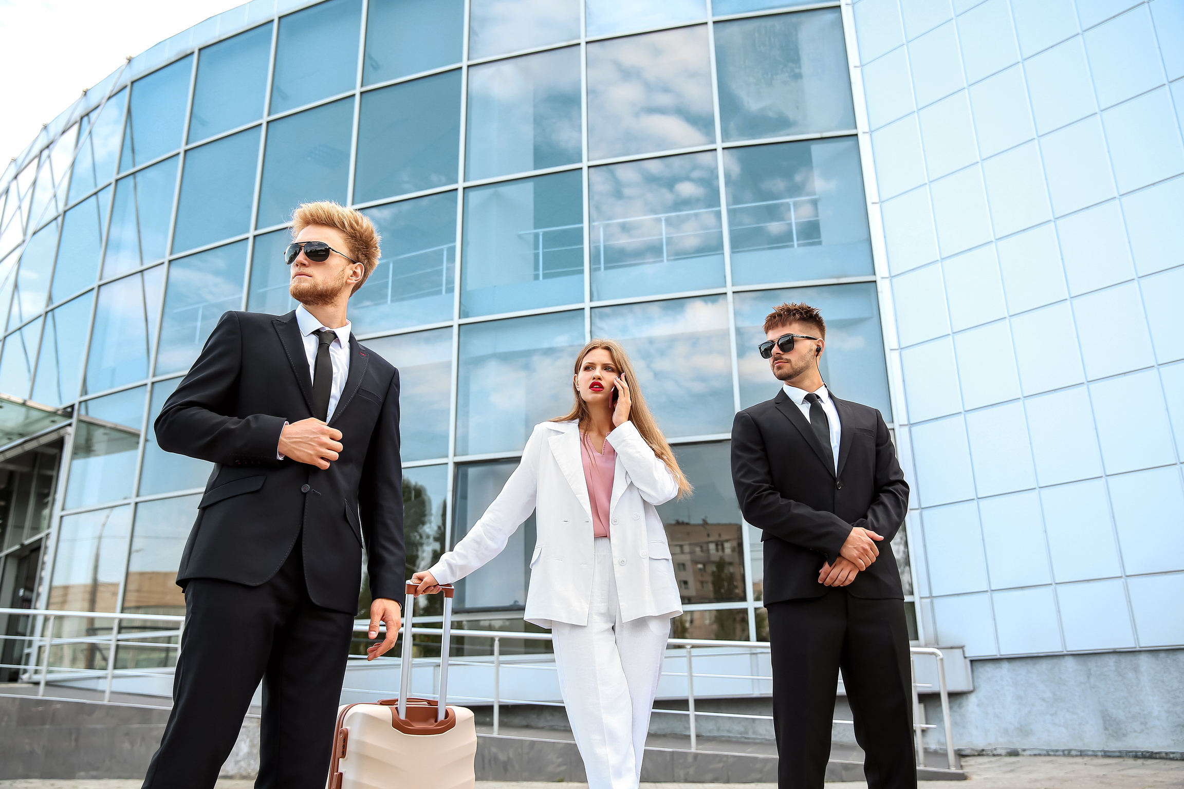 Young Celebrity with Bodyguards in Airport